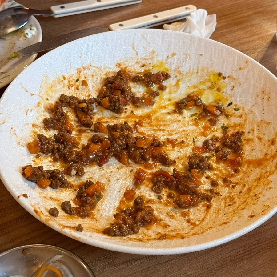 Close-up of beef chunks in the ragu pasta