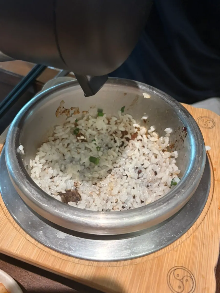 Hot pot rice scooped out into a bowl