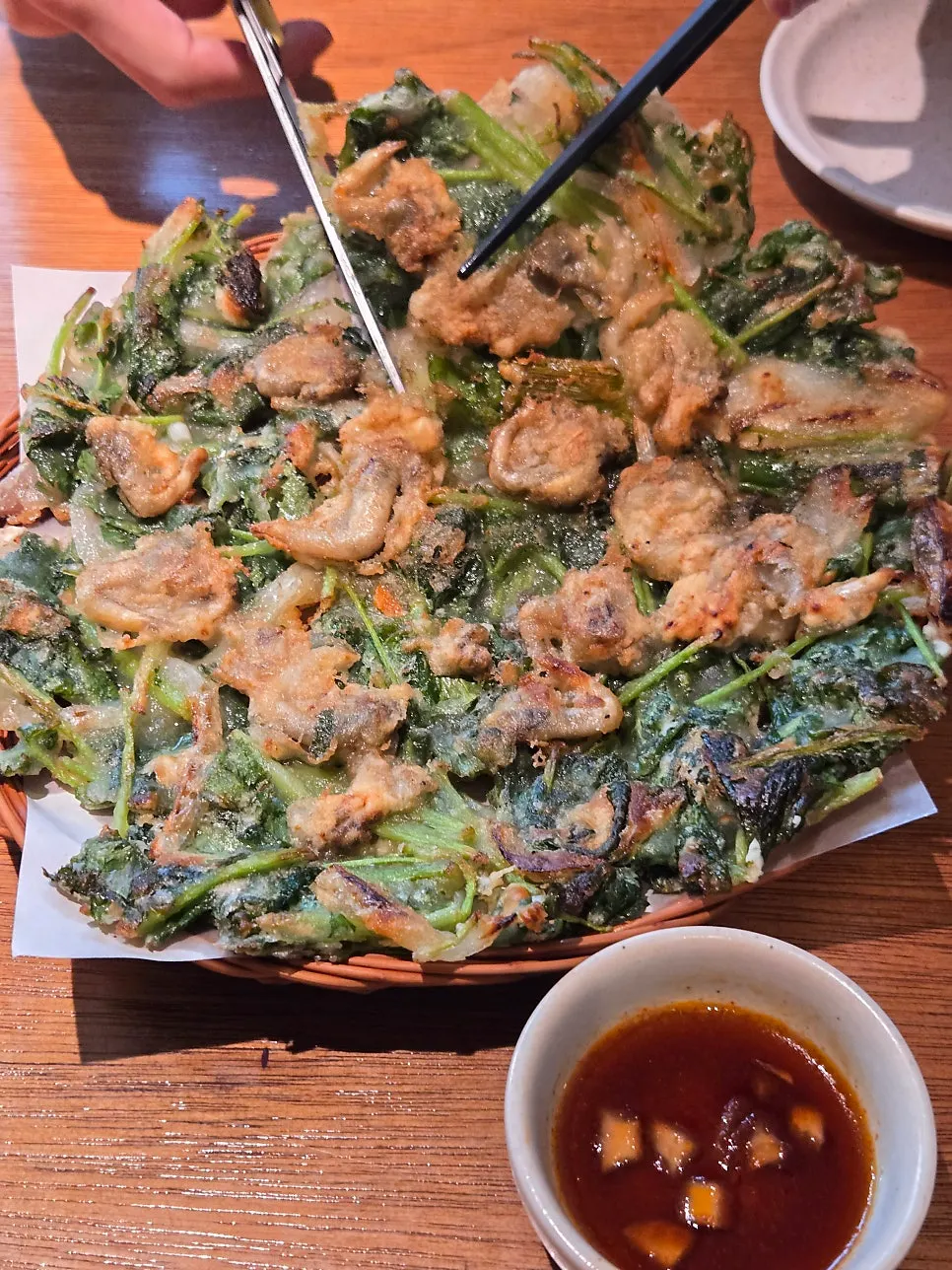 Golden-fried edge of the cockle pancake