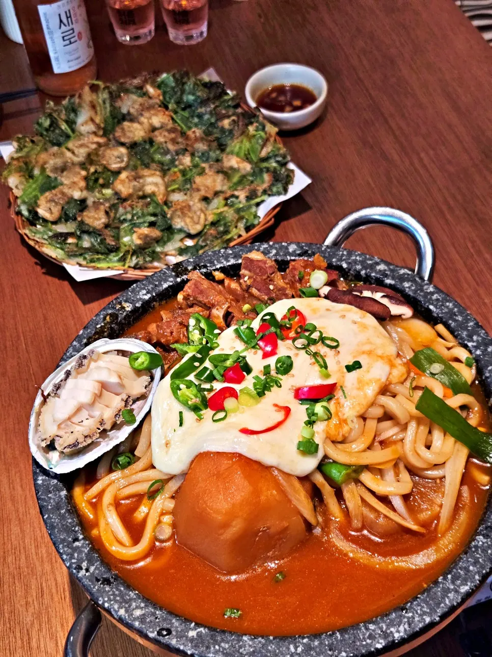 Udon noodles lifted out along with the cheese