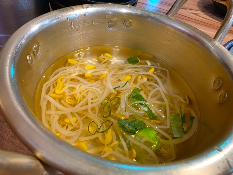 Bean sprout soup served in a brass pot