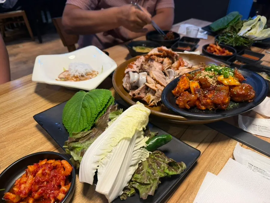 Jokbal wrapped in fresh lettuce leaves