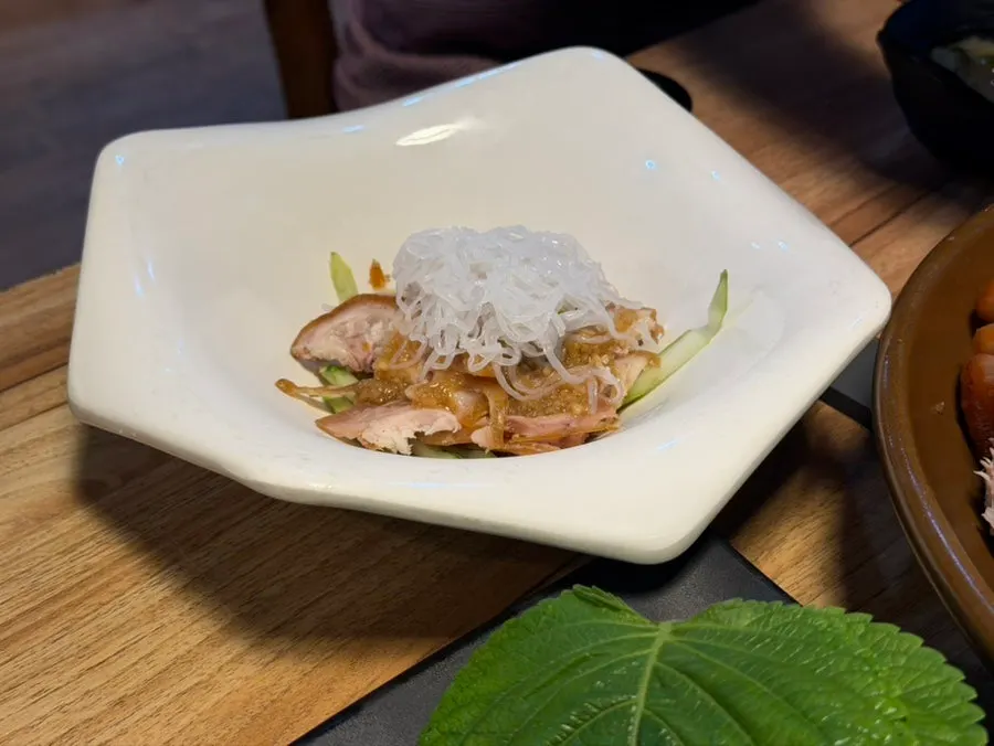 Plate of wrap greens with lettuce, perilla leaves, and alba cabbage