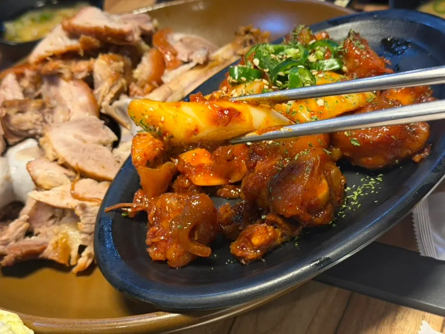 Complimentary naengchae jokbal mixed with cucumber