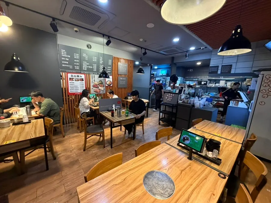 Interior of The Jokbal Sindorim Main Branch with spacious tables