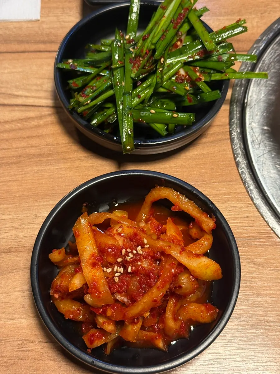 Default spread of lettuce wraps, chives, and radish kimchi