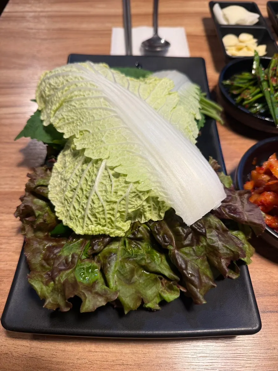 Plate of radish kimchi served as a default side