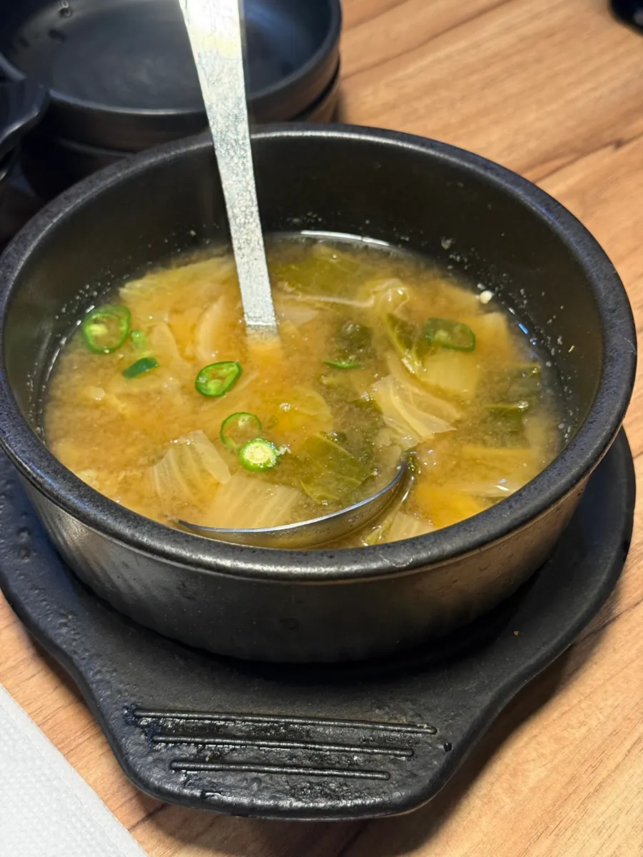 A piece of cold jokbal with mustard sauce