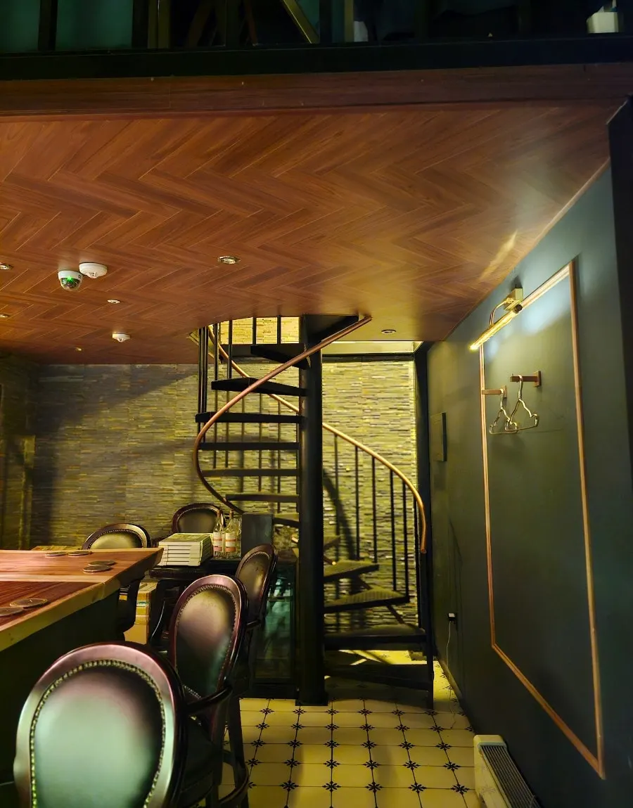 Vertical shot of the bar interior lined with whiskey bottles