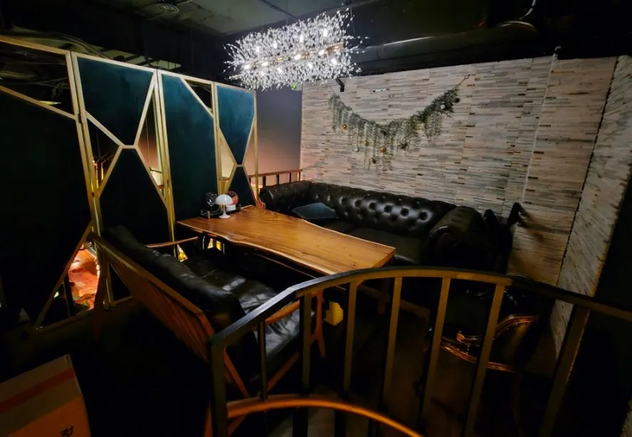 Bar counter seating under dim lighting