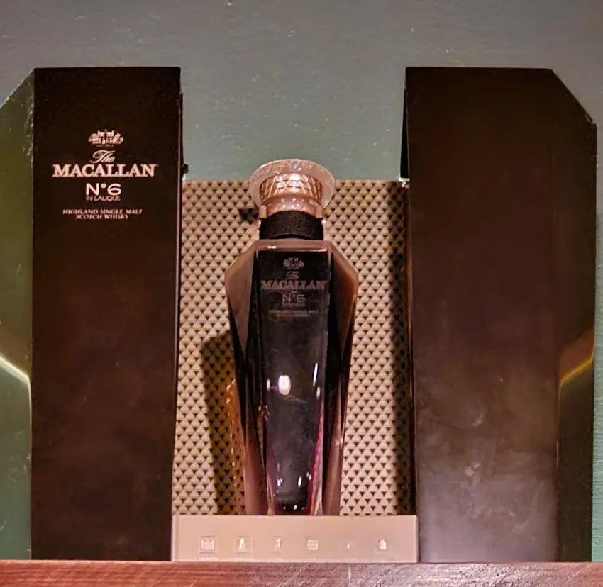 Shelf lined with single malt whiskey bottles