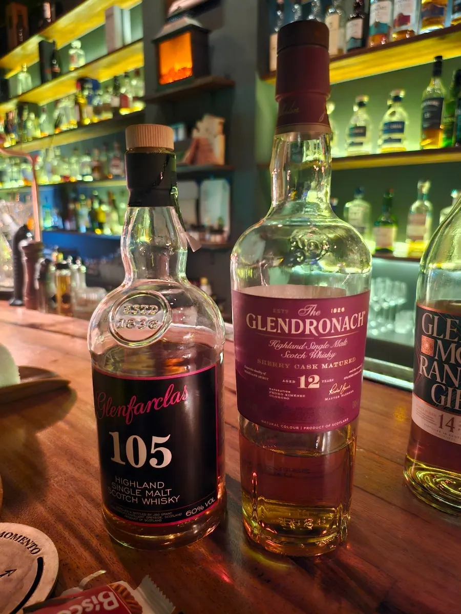 Whiskey being carefully prepared in a glass