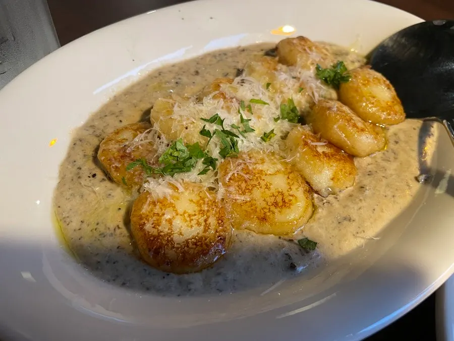Table setting of cream gnocchi and tomato pasta at THE MUA