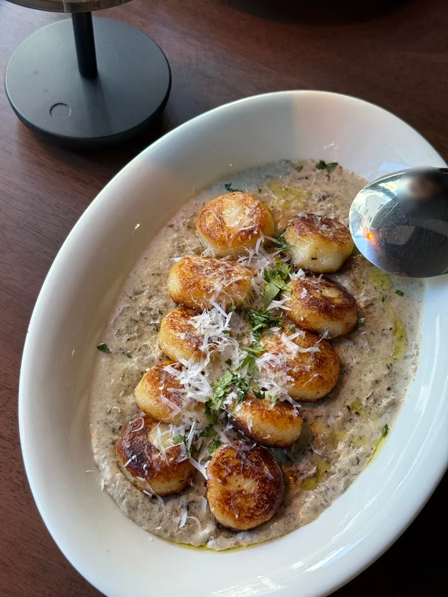 Close-up of ricotta gnocchi with a browned surface