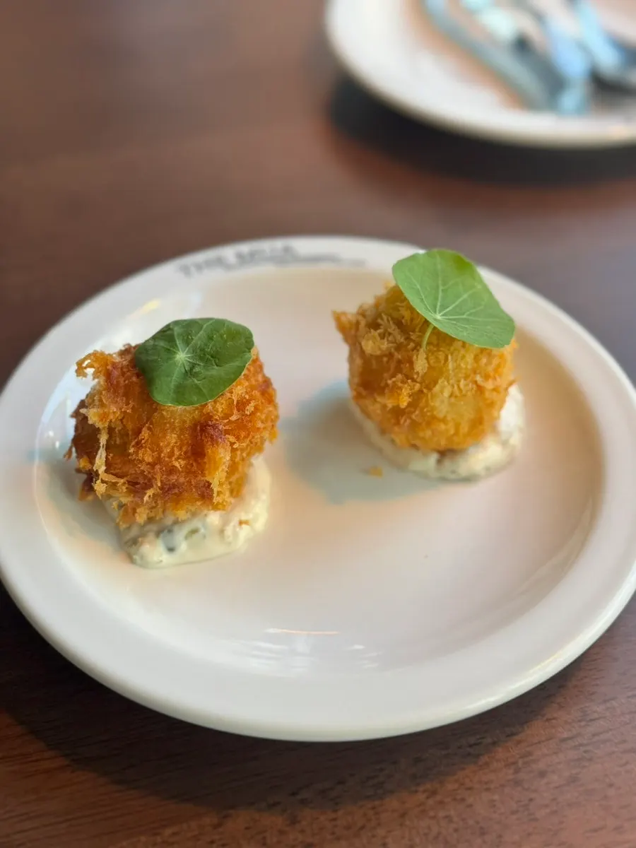 Close-up of the lobster croquettes with steam rising