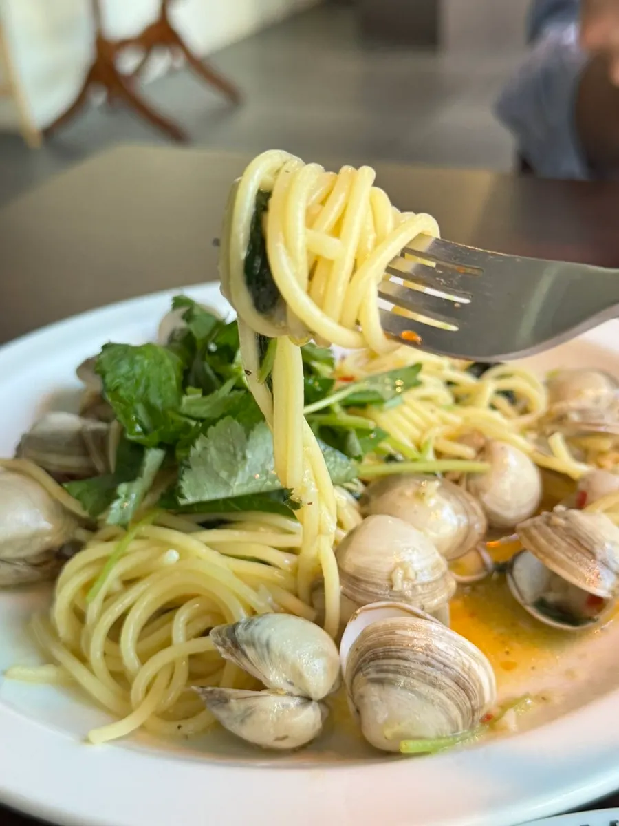 Chamnamul vongole pasta twirled around a fork