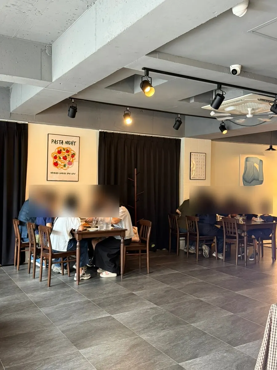 Interior of THE MUA with bright wood-toned decor
