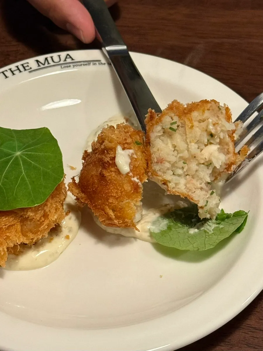 Two pieces of THE MUA's signature lobster croquettes