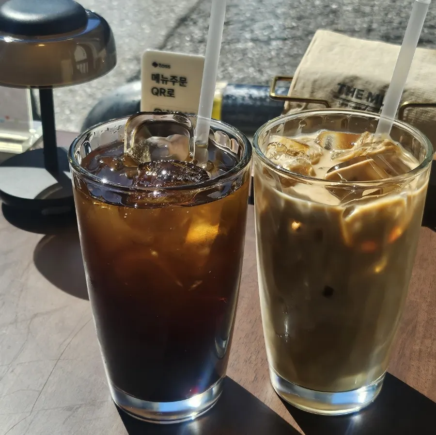 Two coffees placed by the window