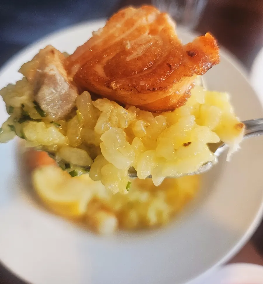 Close-up of risotto topped with a large piece of salmon