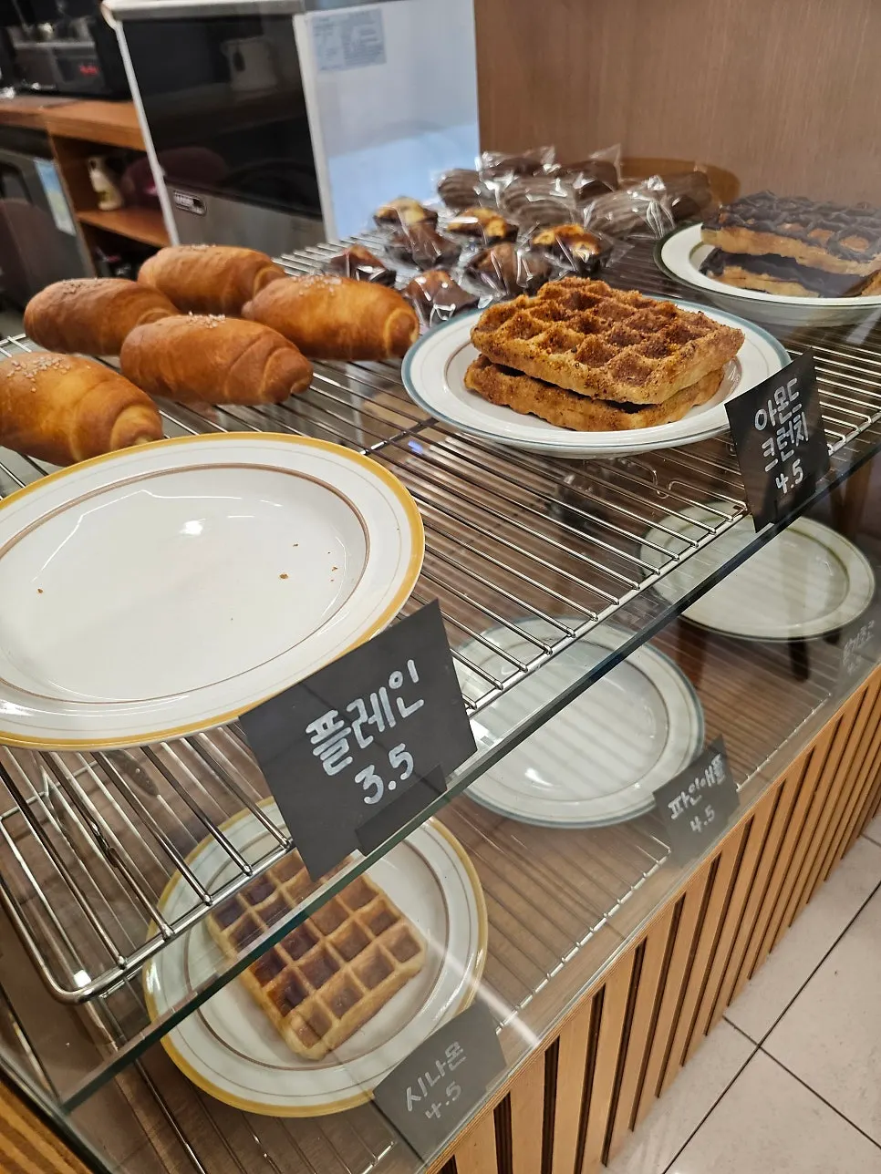 Madeleines and waffles on the display case