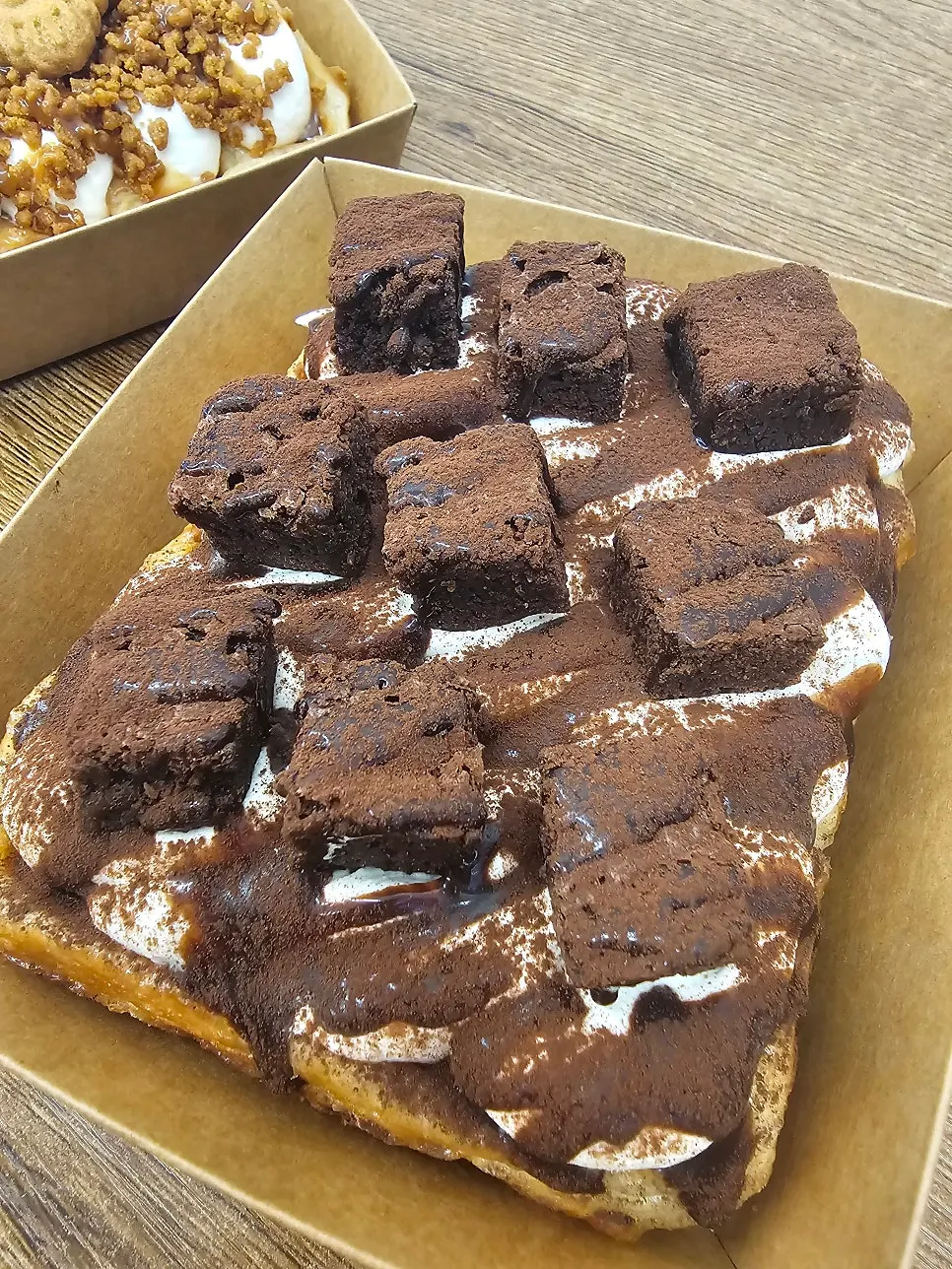 Chocolate brownie waffle piled high with cream