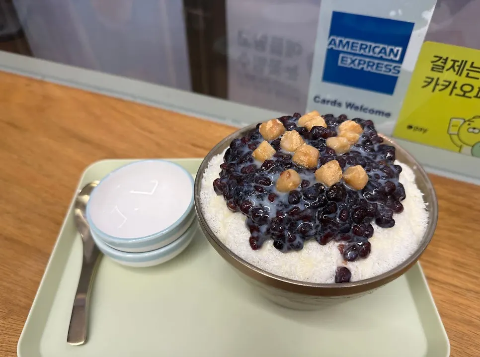 A spoonful of patbingsu with added red bean