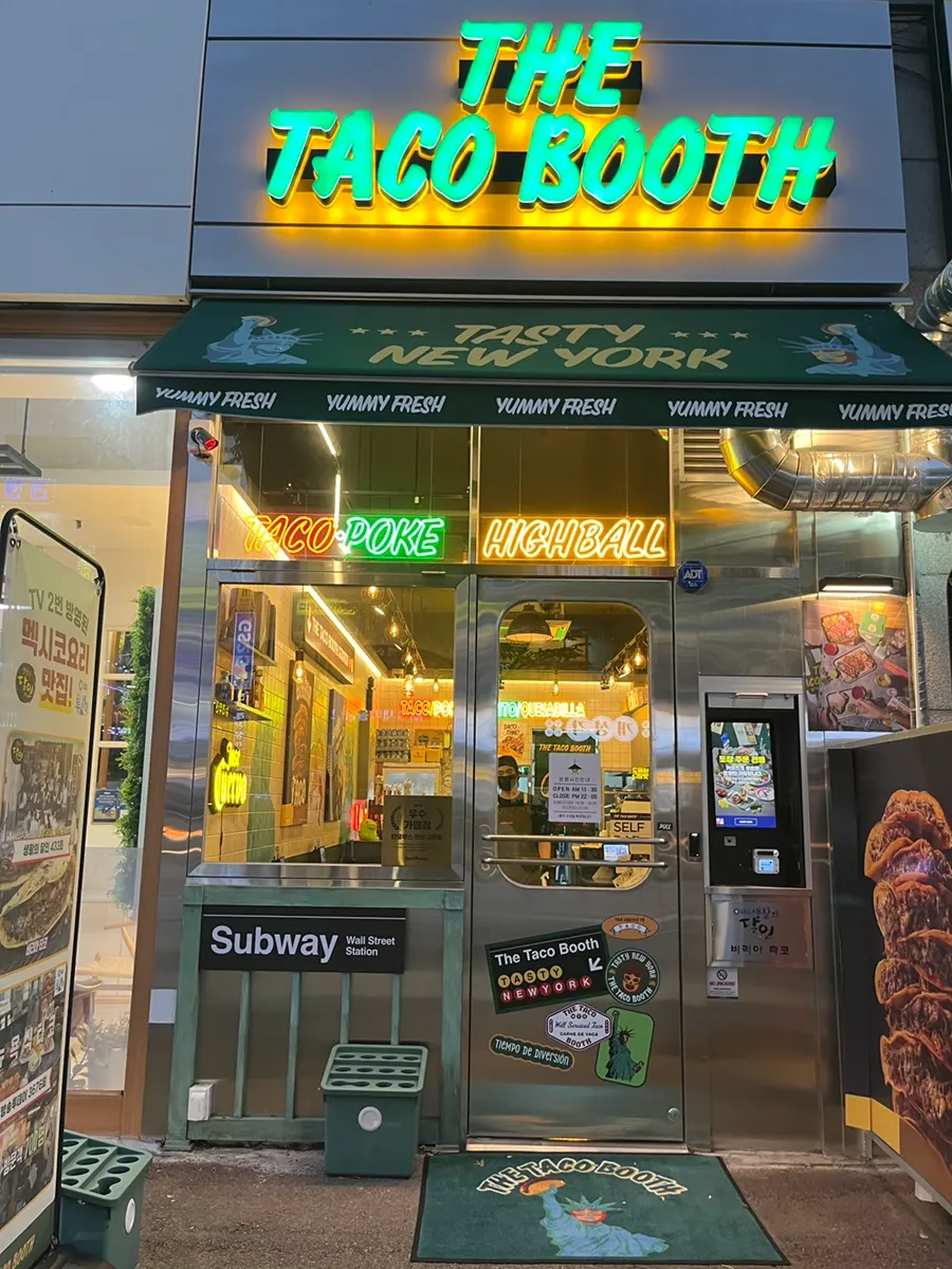 Exterior of The Taco Booth Ansan Gojan Branch with neon and steel interior visible
