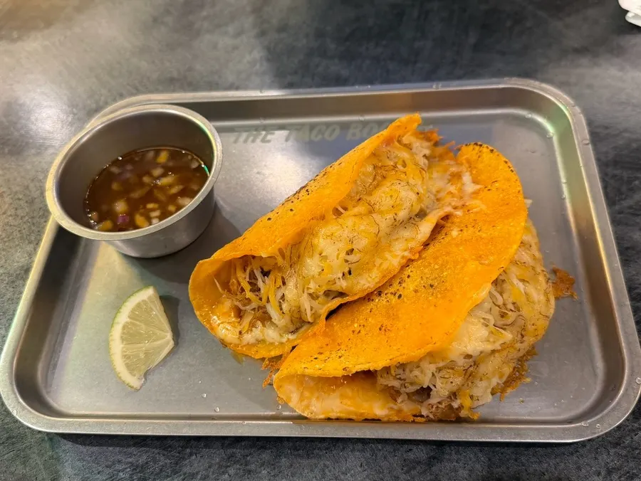 Birria taco loaded with cheese and meat