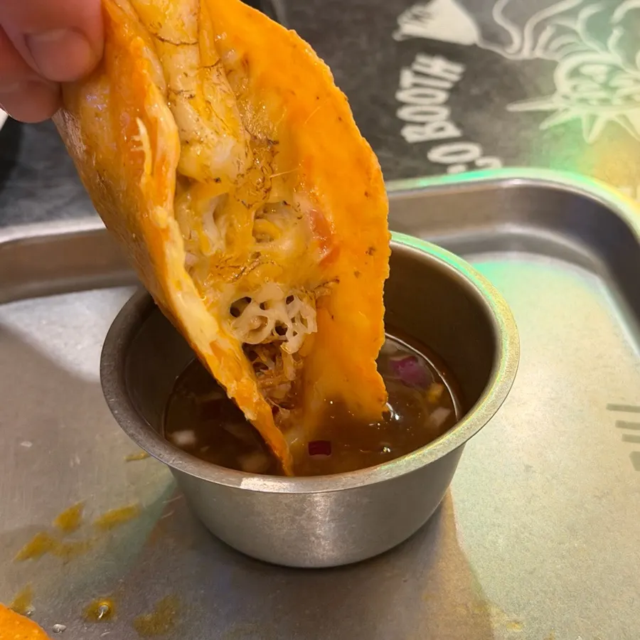 Taco dipped in the special sauce