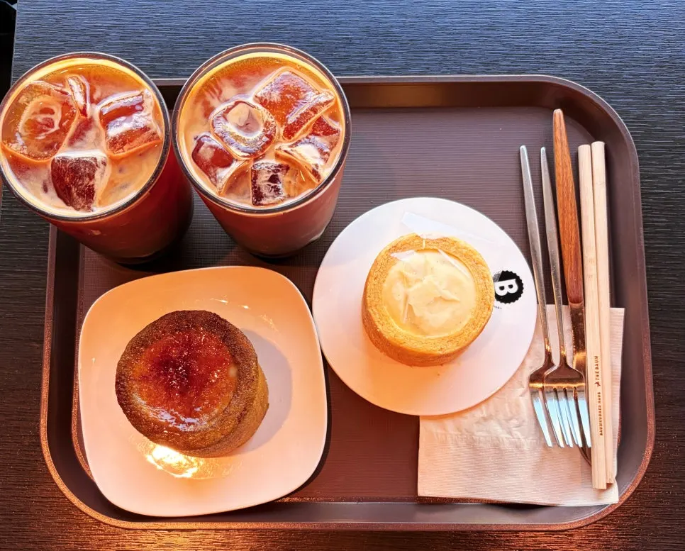 Table with americano and baumkuchen