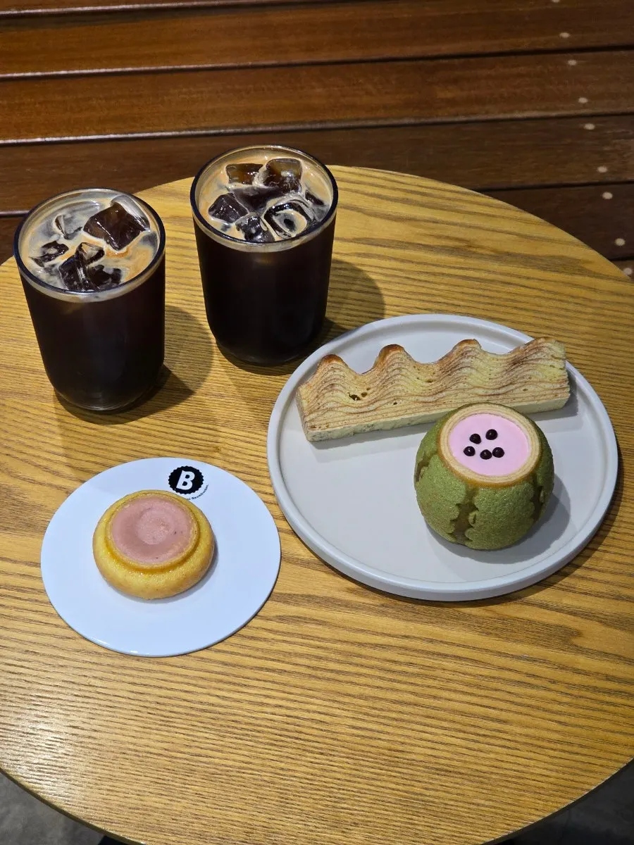 Table with baumkuchen dessert and coffee together