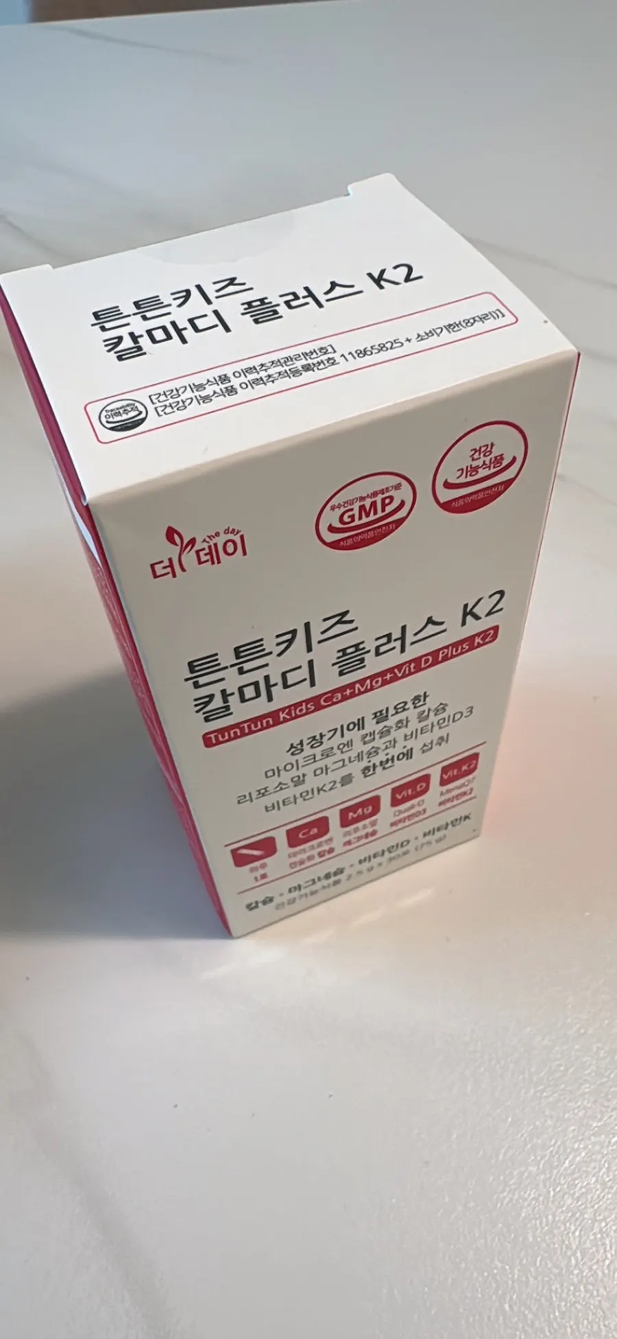 The red-and-white packaging of The Day Cal-Mag