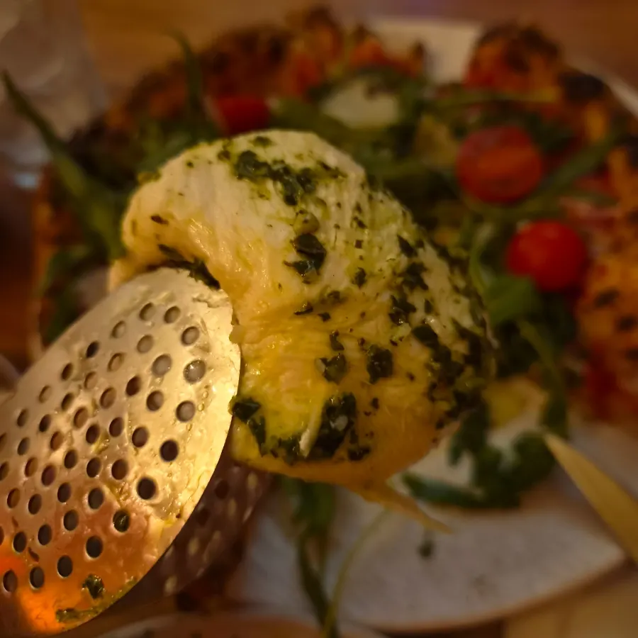 Whole burrata cheese placed on top