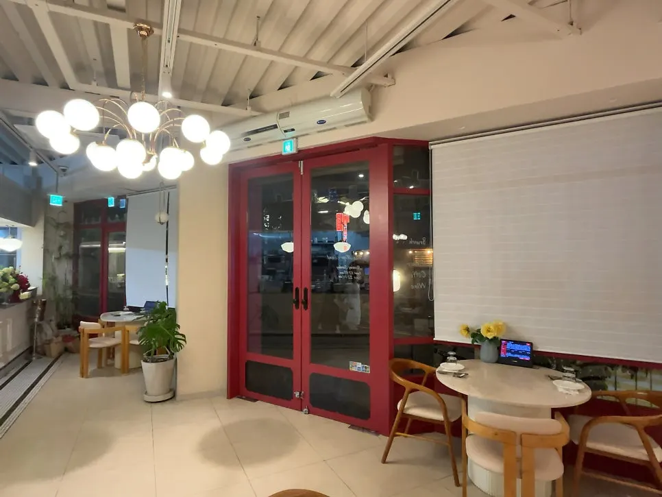 First floor interior of The Mignon Seoul with flowers and pots