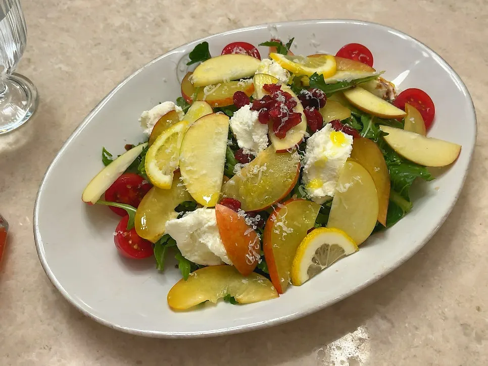 A plate of seasonal fruit ricotta cheese salad