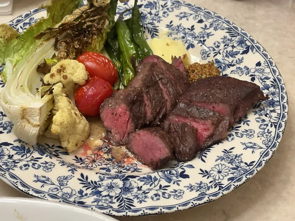 Sirloin cap steak paired with napa cabbage and mashed potato