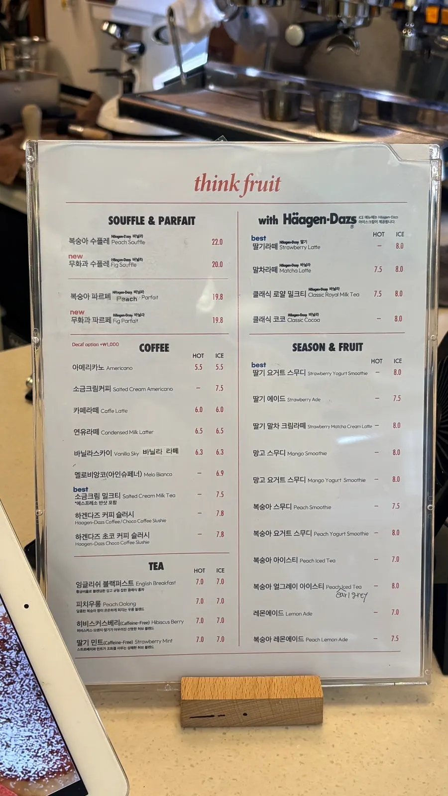 Think Fruit's menu board listing peach and fig items