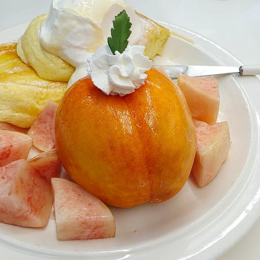 Greek yogurt inside a halved peach