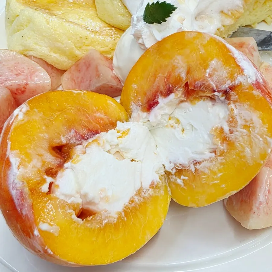 Peach and Greek yogurt scooped together