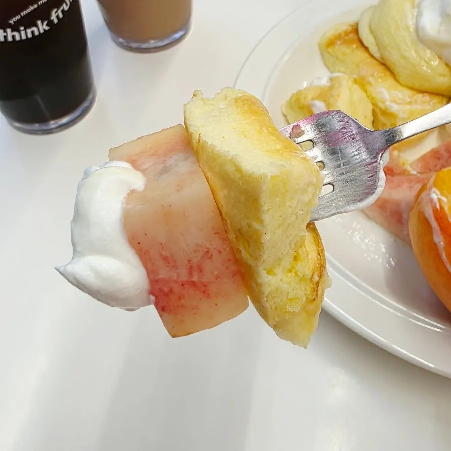Soufflé topped with cream and ice cream