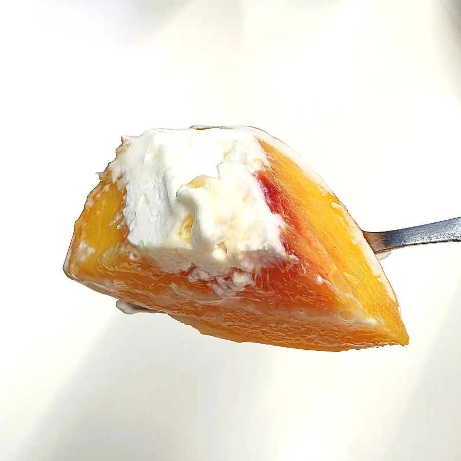 Plate of peach soufflé mid-meal