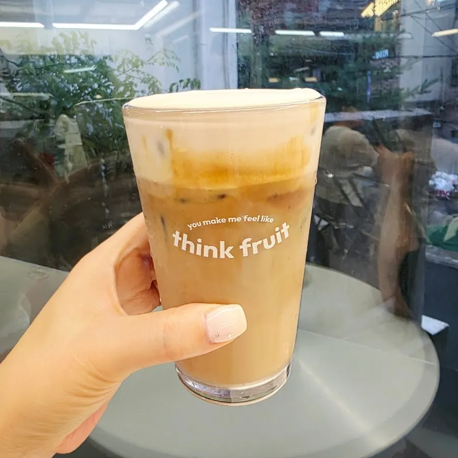 A glass of Think Fruit's salted cream milk tea