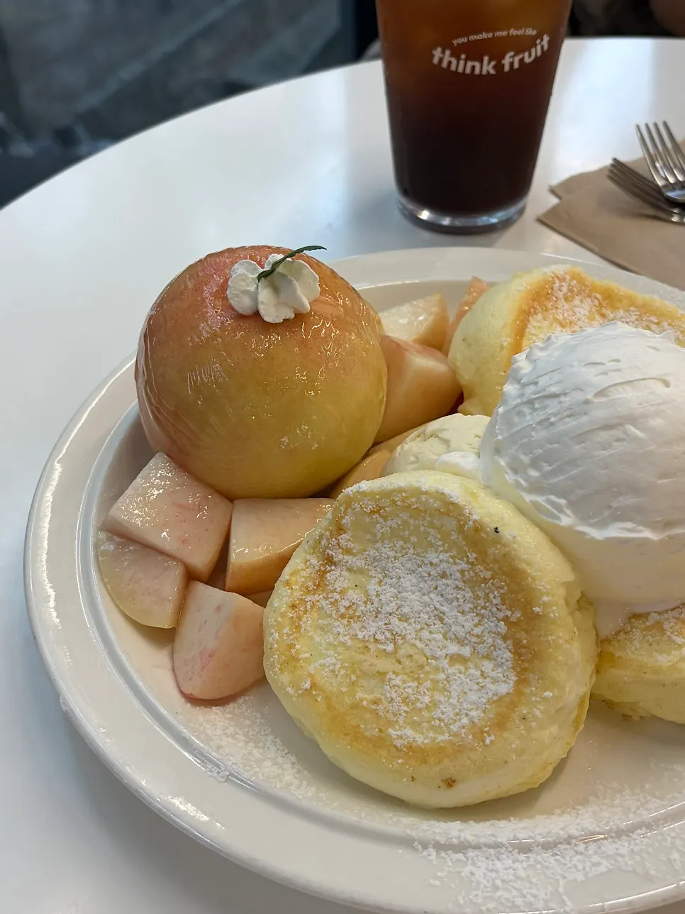 Peach soufflé pancake soaked with syrup