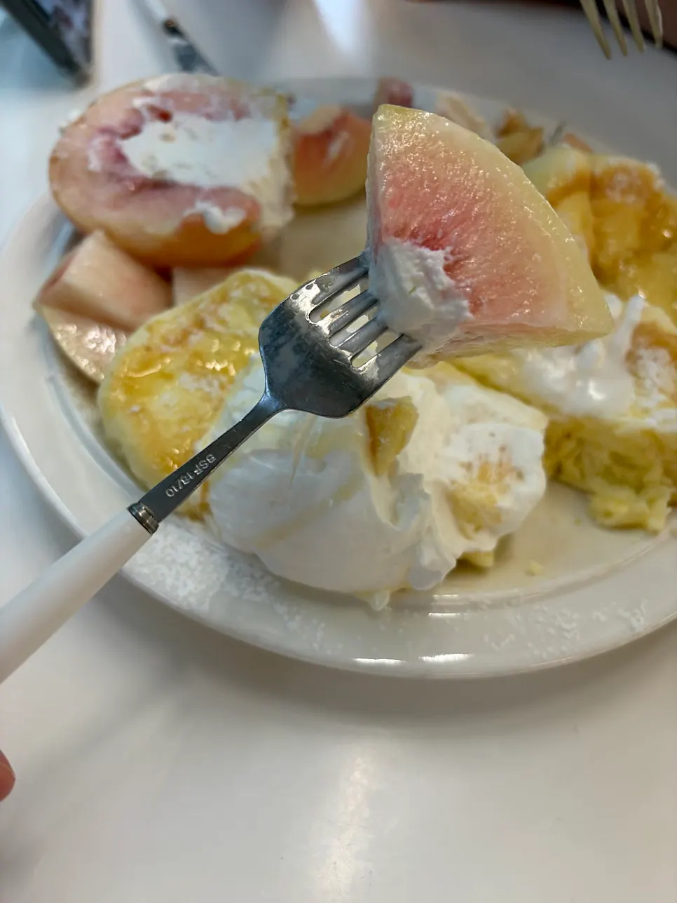 Greek yogurt and peach slices inside the soufflé
