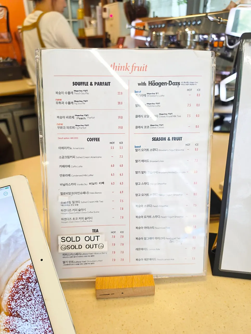 Menu board showing Think Fruit soufflé prices