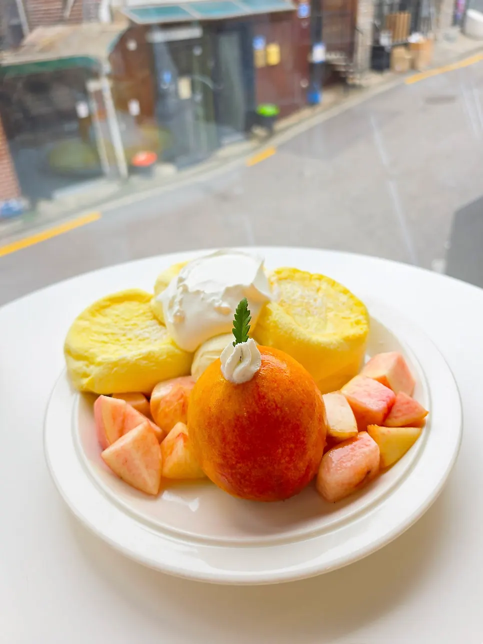 Greek yogurt inside a halved peach