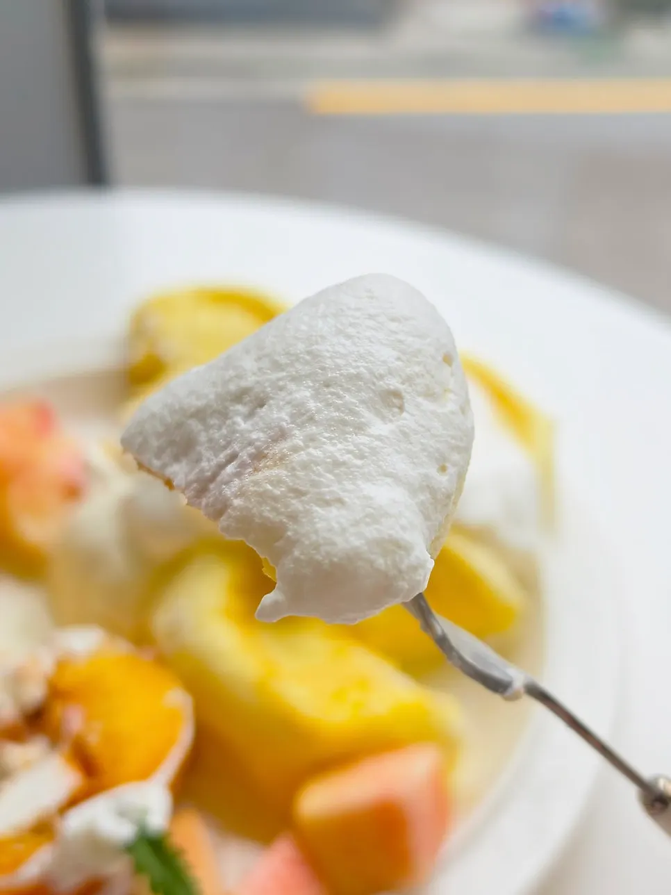 Fork slicing into the fluffy soufflé pancake