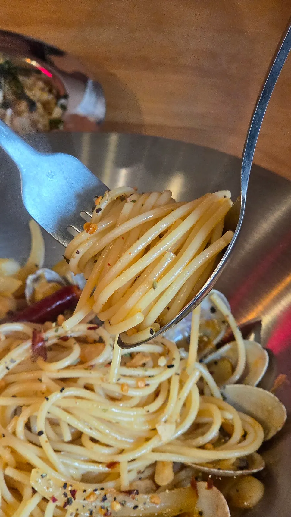 A bite of bongolele pasta with garlic and clams