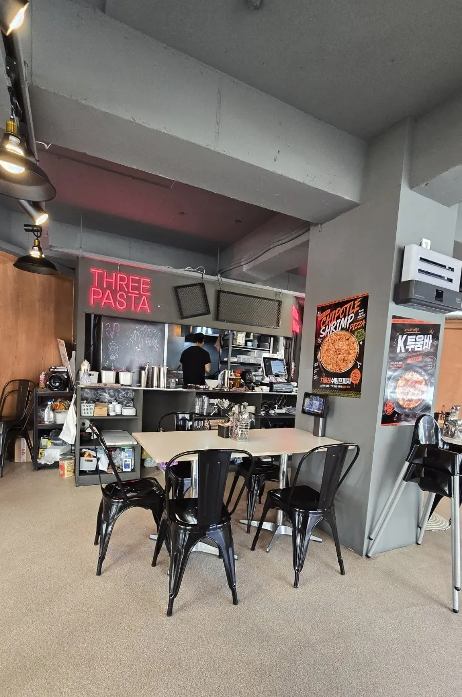 Interior with black metal chairs and soft lighting